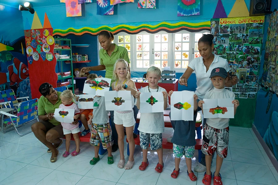 Children painting shirts at the Tryall Kids Club