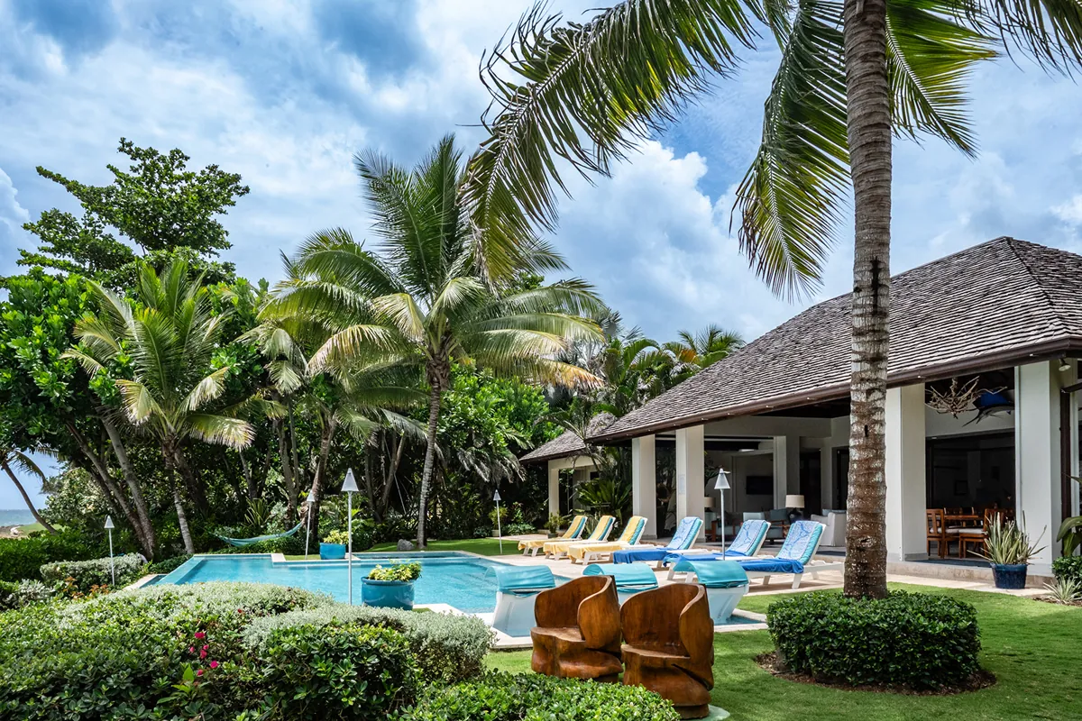 A Tryall villa: the whole house, pool and lawn under the palms at the water's edge